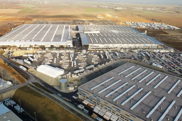 Manufacturing facility yard with vehicles and equipment
